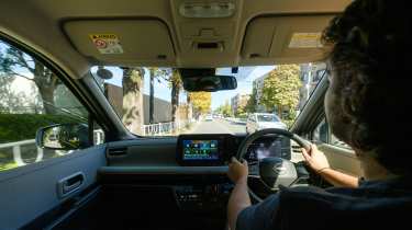 Nissan Sakura - front interior, car being driven by Auto Express senior staff writer Jordan Katsianis in Japan 